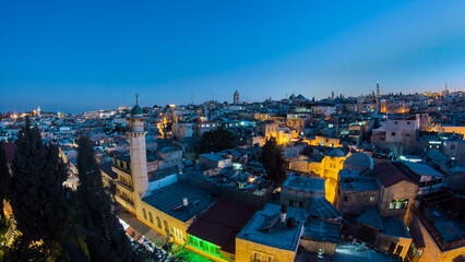 Naklejka premium Skyline of the Old City in Jerusalem with historic buildings aerial timelapse, Israel.