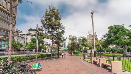Red cycling track in the Jose Larco avenue and bicycle parking timelapse hyperlapse in Miraflores, Lima Peru