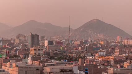 Naklejka premium Panoramic skyline of Lima city from above with many buildings aerial timelapse. Lima, Peru