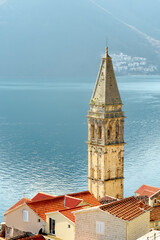 Scenic view of the church and the buildings of the old town of Perast. Sightseeing in Montenegro