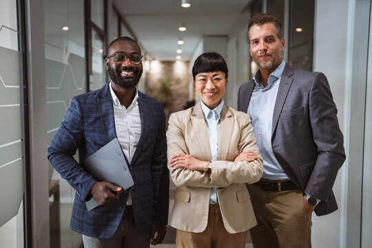 Group of diverse businesspeople stand and pose in the in the company