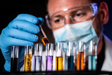 laboratory scientist testing toy paint samples for lead contamination using advanced chemical analysis equipment