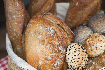 Freshly baked bread and rolls in a woven basket