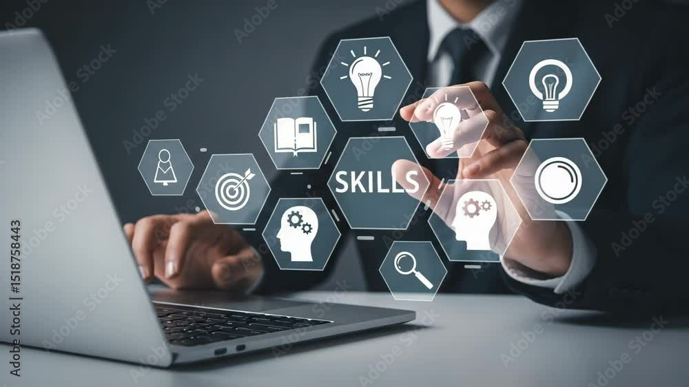 Aufkleber Man using laptop with skills icons including lightbulb book and target in front of him on a table