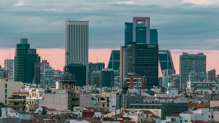 Madrid Skyline at sunset timelapse with some emblematic buildings such as Kio Towers
