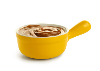Bowl of sweet melted chocolate on white background