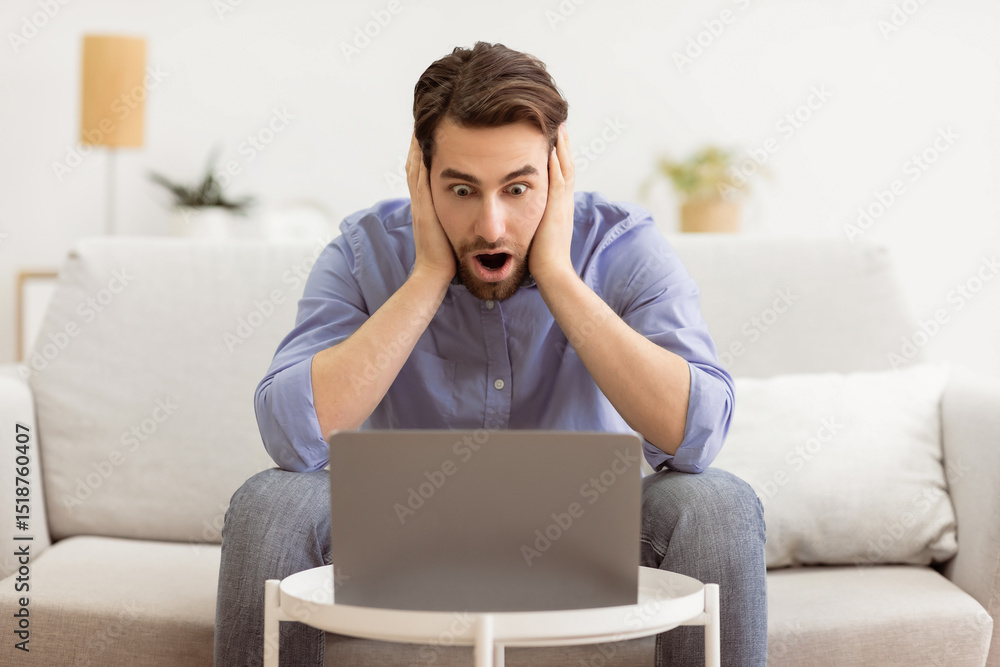 Poster shocked businessman at laptop computer touching head having problem working online sitting on couch 