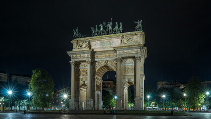 Obraz premium Arch of Peace in Simplon Square timelapse hyperlapse at night. It is a neoclassical triumph arch