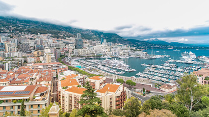 Obraz premium Monte Carlo city aerial panorama timelapse. View of luxury yachts and apartments in harbor of Monaco, Cote d'Azur.