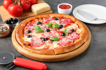 Tasty pizza and ingredients on grey table, closeup