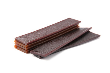 Pieces of delicious fruit leather on white background