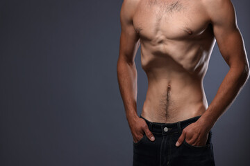 Fototapeta premium Man suffering from anorexia on grey background, closeup. Space for text