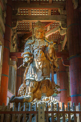 Nara, Japan - Sep 26 2024, vertical view from below of the ancient wooden statue of Komokuten, one...