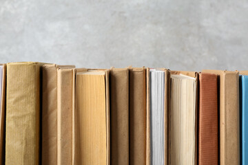 Row of books on grey background