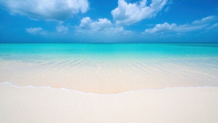 Obraz premium Calm tropical beach with soft white sand and clear turquoise water under a bright blue sky with scattered clouds