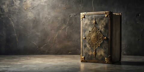 An Antique Book with Ornate Gold Accents Rests on a Dark Surface