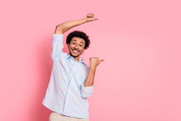 Lively Young Man Posing with Enthusiasm Against a Vibrant Pink Background, Showcasing Dynamic...
