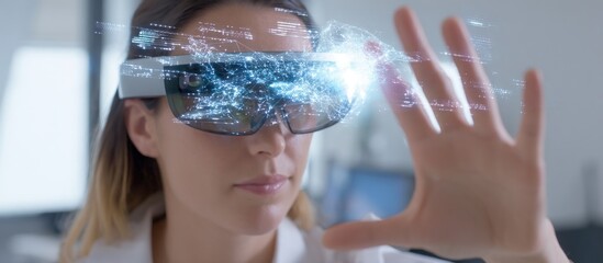 Woman wearing vr headset with digital overlay reaching out with her hand in a bright environment