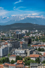 Urban panorama of Ljubljana's diverse architecture with modern buildings and historic rooftops...