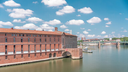 Aerial hyperlapse of Toulouse's historic Hotel Dieu Saint-Jacques by the Garonne River, France.