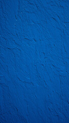 Obraz premium A close up of a textured blue painted surface with visible cracks and brushstroke patterns on the wall