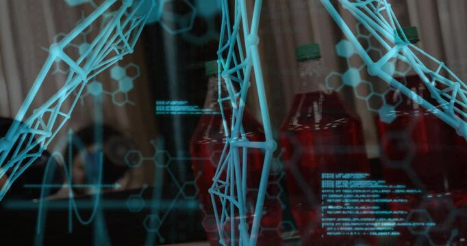 Scientist typing at laptop initiating wireframe emerging with code around green-capped red bottles