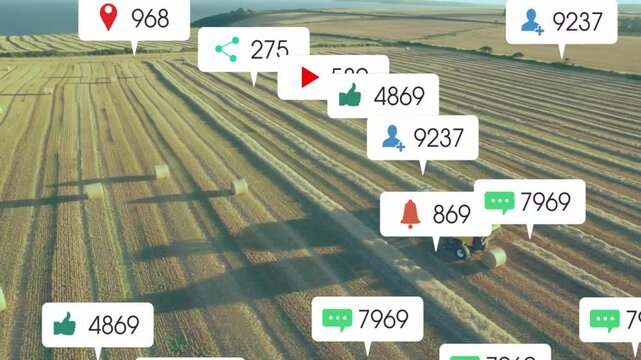 upon baling starting tractor towing baler driving, while icons multiplying then fading showing data