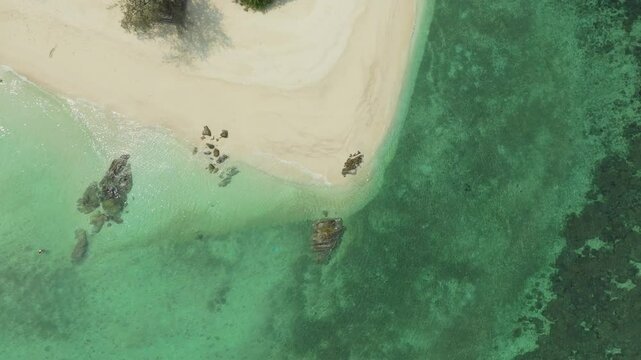 Nature of the beach and sea Summer with sunshine, sandy beaches, clear blue waters sparkling against the blue sky. On an island with good ecology and environment Background for summer vacation