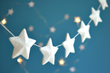 a string of white stars hanging from a string