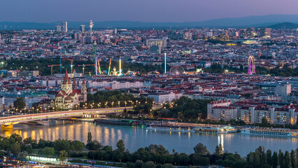 Aerial panoramic view over Vienna city with skyscrapers, historic buildings and a riverside...