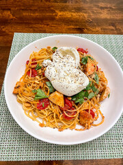 Comfort meal spaghetti overhead flat lay on wooden table