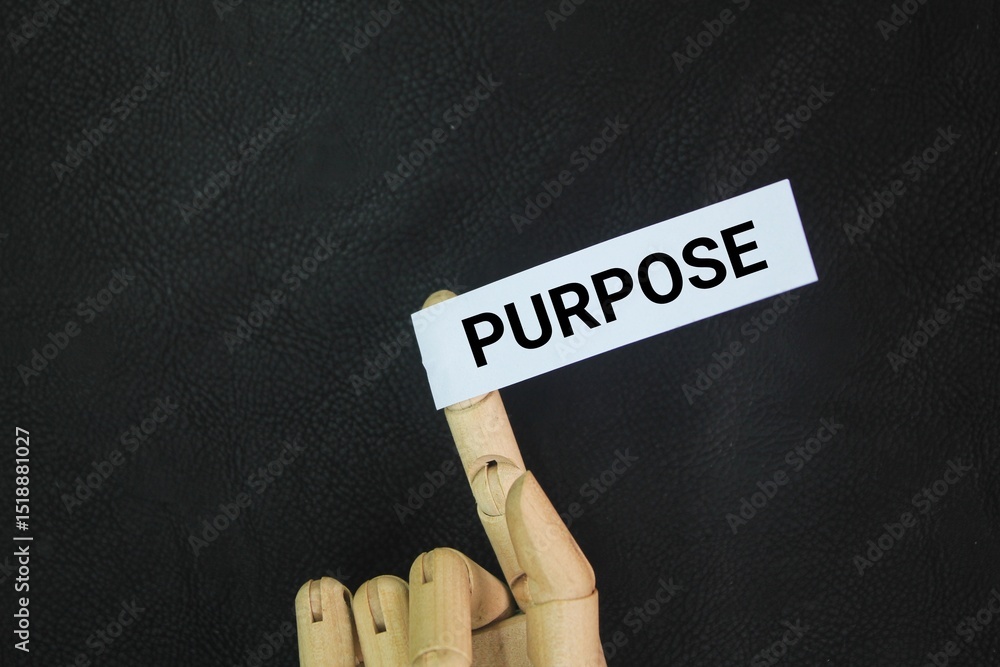 Poster hand and colored paper with the word purpose. the reason for which something is done or created or f