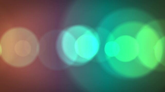 オレンジとブルーのネオンのように光るアーバンな玉ボケ　大きなボケの水平　15秒ループ