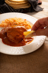 Pipian with Chicken, food from Mexico and other Latin American countries, chicken meat bathed in mole sauce made with pumpkin seeds, dried chili peppers and several other ingredients.