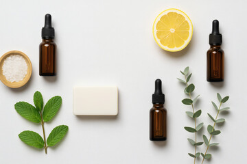 Skincare items including bottles, a soap bar, lemon, and greenery, highlighting natural ingredients.