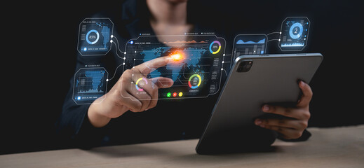 A person interacts with a futuristic digital interface using a tablet, showcasing advanced...