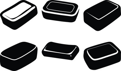 Assorted shapes of black soap bars or candies, displayed in different directions