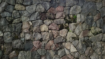 Stack of neatly arranged rocks, textured stone background