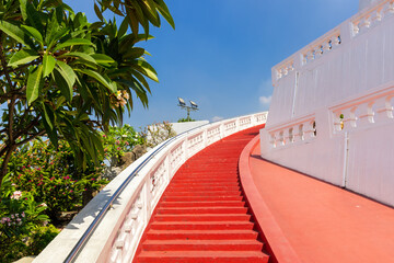 Red curved steps up to temple of Wat Saket or Golden Mount, Bangkok, Thailand.