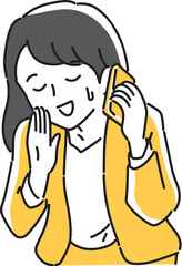 スマホを耳に当てて謝る女性