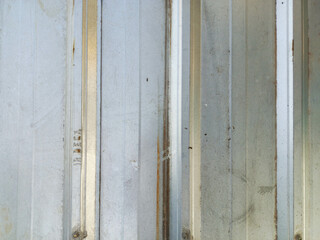 Weathered Silver Metal Wall with Vertical Lines Texture Backgrou