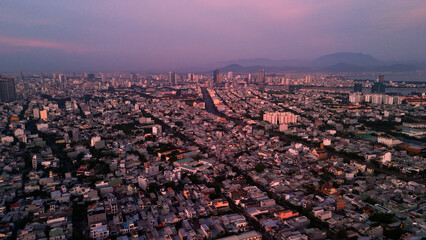Twilight cityscape revealing da nang's urban landscape, spanning residential zones and central...