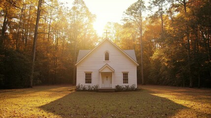Serene white church surrounded by autumn trees with golden sunlight streaming through the leaves du a peaceful fall morning
