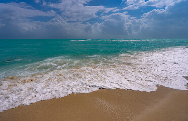 Ocean waves and sand on sky. Stormy sea waves. Summer sea beach wave. Foamy ocean waves. Summer ocean breeze. Dreamy summer beach background. Ocean splash waves.