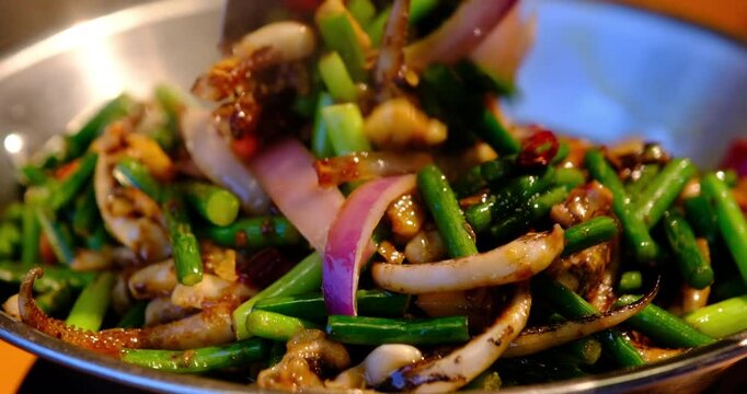 cooking squid with garlic sprouts