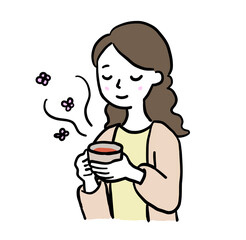 お茶を飲んでリラックスする女性