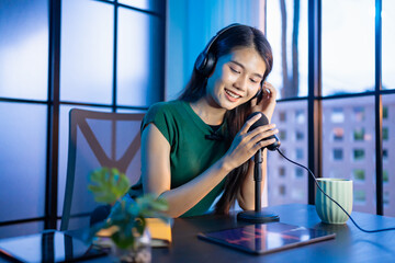 Content creator Young asian woman influencer creating content in home studio entertainment and...