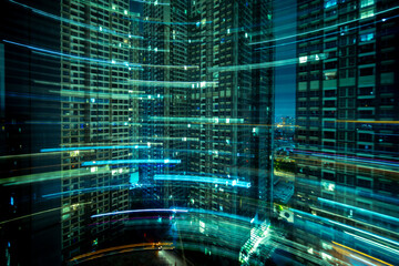 A captivating nighttime view of a bustling metropolis with high-rise buildings adorned with light trails, captured in a teal-toned long-exposure style.