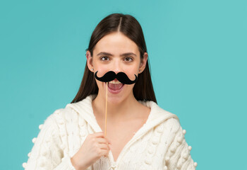 Girl, moustache and happy with prop. Comic woman portrait. Funny face with moustache on stick. Funny woman holding paper moustache party stick. Girl holding funny mustache.