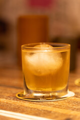 A glass of whiskey on the table